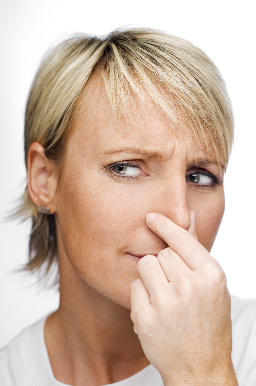 Image of woman holding her nose due to bad sewer gas smell